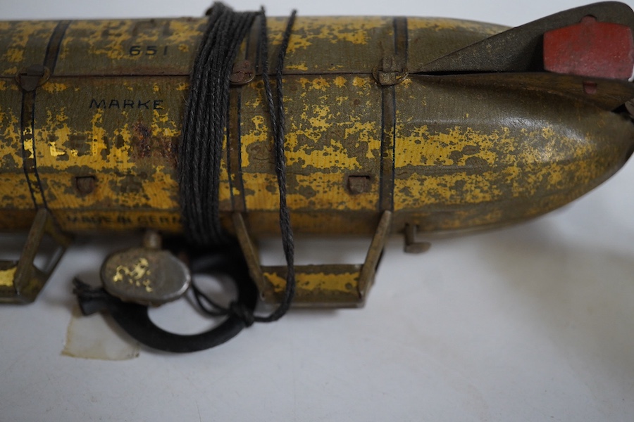 An early 20th century Lehmann tinplate clockwork EPL-1 zeppelin, 651, with rotating propellers to the rear. Condition - poor to fair, considerable losses to paint work, however clockwork motor still has some strength.
